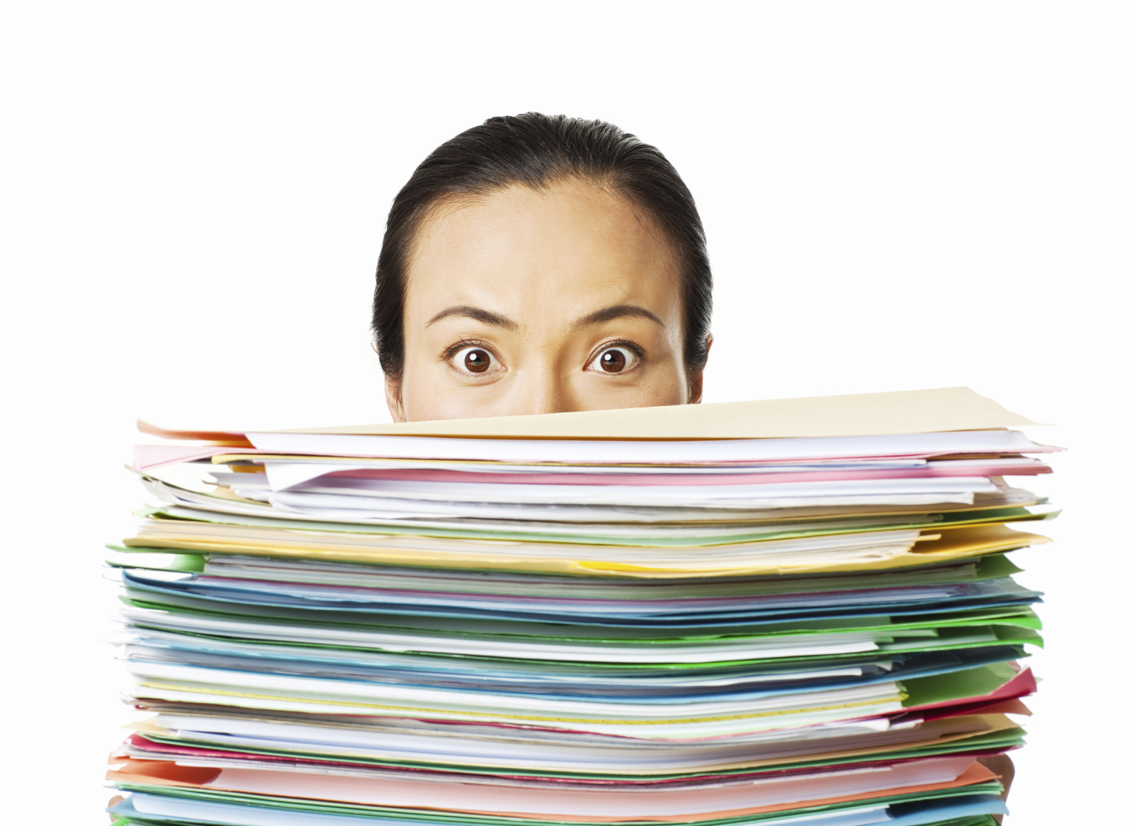 Woman looking over a stack of paperwork. Horizontal shot. Isolated on white.